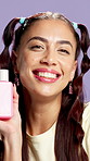 Beauty, product and face of woman in studio for skincare, makeup and cosmetics campaign. Happy, salon and portrait of person with bottle for dermatology, facial care and promo on purple background