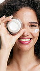 Face, woman and container with cream for beauty, facial shine or dermatology with skin moisturizer. Sunscreen, skincare and lotion over eye for antiaging, female person with natural glow and smile