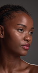 Thinking, skincare and black woman in studio for beauty, cosmetology and face aesthetic. Idea, makeup and model with cosmetics for self care, skin health or shine for dermatology on gray background