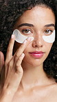 Face, skincare and woman with eye patches for glow, hydration or natural detox. Portrait, beauty and model apply mask for dark circles, facial treatment or dermatology with cosmetics in studio