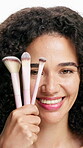 Makeup, brush and woman with smile, face and tools for beauty, studio and self care with foundation. Happy, African person and cosmetics application with products, skincare or  pride for soft skin