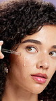 Woman, skincare and dropper with face in studio for moisturizer, hyaluronic acid or beauty on background. Girl, model and serum for dermatology, cosmetics and application with essential oil in Brazil