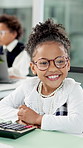 Girl, child and face at office, pretend and calculator for accounting job, happy and glasses at agency. Kid, smile and portrait with finance career, role play and excited with confidence at workplace