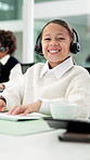 Playing, call center and face of child by desk for consultant, contact and virtual assistance. Pretend, business office and portrait of girl with headset for customer service, online support or help