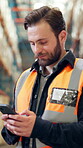 Industrial engineer, texting and man with smartphone, warehouse and planning for stock distribution. Typing, message and person with tech for shipping schedule, logistics and communication on website