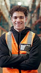 Face, distribution and man in warehouse, arms crossed and smile with logistics, confidence and storage. Person, pride and employee in factory, supply chain and manufacturing with career ambition