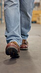 Shoes, person and walking for logistics at warehouse for inspection, quality control and supply chain. Feet, man or storage for stock check, inventory management and supervisor for cargo distribution