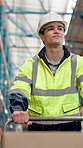 Supply chain, pushing trolley and man in warehouse, thinking and shipping with manufacturing. Person, logistics and employee in factory, safety or industrial with inventory management or distribution