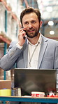 Laptop, phone call and thinking with man in warehouse for delivery or logistics management. Communication, computer and planning with employee in factory or plant for distribution, stock and storage