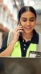 Logistics, woman or laptop with phone call in warehouse for tracking parcel, delivery update or shipping. Supply chain, worker and talking to client with tech for stock quote and online order details