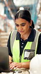 Laptop, logistics and woman typing in warehouse for inventory, shipping or check schedule. Computer, distribution or happy person planning storage for stock procurement, supply chain or freight email