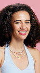 Beauty, accessory and face of woman in studio for shine, cosmetics and curly hair for growth. Happy, aesthetic and portrait of person with clips for hairstyle, cosmetology and glow on pink background
