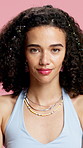 Hair, accessories and face of woman in studio for beauty, cosmetics or growth for volume. Happy, aesthetic and portrait of person with clips for curly hairstyle, shine or confident on pink background