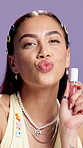 Face, lip gloss and woman in studio, pout and dermatology on purple background. Cosmetics, luxury product and person with beauty, skincare and flirting with shine, grooming or treatment for glow