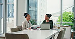 Women, team and laptop with documents, finance and smile for discussion in office at investment agency. Business people, paperwork and computer for charts, planning or feedback with report at company