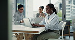 Typing, business woman and team in office with laptop for research, planning and project management. Coworking, people or employee in workplace with computer for risk assessment, review and feedback.