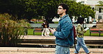Phone, thinking and walking with man on university campus for education or learning scholarship. App, communication and social media with college student outdoor for development, future or study
