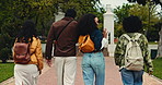 Campus, students and back of friends walking to class for learning, education and knowledge at university. School, academy and people travel to lesson for college, scholarship and studying together