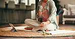 Fitness, drinking water and person in lounge with tablet, indoor exercise or streaming video for thirst. Hydration, online workout class and woman relax with liquid in home, break or rest on yoga mat