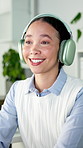 Headphones, music and happy business woman listening to streaming service in workplace. Audio, smile and worker in office for radio, online sound and dancing to song for entertainment on break