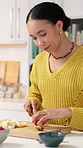 Woman, cutting and fruit in kitchen at house with healthy snack, meal prep and breakfast wellness. Female person, organic and chop ingredients for vegan salad, nutrition brunch and digestion benefits