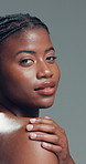 Beauty, face and natural with black woman in studio for body care, cosmetics or dermatology. Aesthetic, skincare and wellness with confident African model on gray background for benefits or results