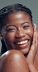 Skincare, face and funny black woman with glow, beauty or self care on gray background in studio. Natural cosmetic, laugh or model touch skin for shine, treatment results or dermatology with portrait