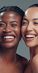 Face, skincare and women laughing in studio for beauty, dermatology and natural glow. Wellness, cosmetics and funny girls together with friends for diversity, shine and aesthetic on gray background
