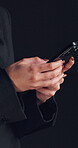 Hands, business and woman with phone in studio for communication, social media and texting. Mockup space, person and typing with mobile for research, reading email and notification on dark background