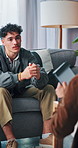 Therapist, counselling or man with stress in office, support or discussion for mental health assessment. Communication, patient and psychologist help in consultation, evaluation and listen to advice.