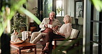Happy, old couple and cheers in home with coffee for relax, bonding together or healthy marriage. Smile, married or elderly people with hot drink in living room for love, connection or morning break.