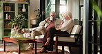 Drink, toast and mature couple on sofa with love, conversation and catch up in romantic moment. Happy, senior man and woman in house with coffee mug, cheers and reunion in healthy relationship.