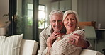 Face, hug and mature couple on couch with smile, support and commitment in healthy relationship. Flare, senior man and woman in house with embrace, bonding together and happiness in romantic moment.