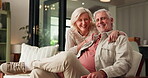 Face, hug and mature couple on sofa with smile, support and commitment in healthy relationship. Flare, senior man and woman in house with embrace, bonding together and happiness in romantic moment.