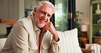 Senior man, face and happy in home lounge with a positive attitude, laughing and funny humor. Elderly person, relax and comfort on sofa in living room with retirement, pension and smile in house