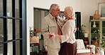 Dancing, senior couple and fun in home, romance and happy for break in living room and relationship. Retirement, old woman and elderly man with rhythm, celebration or bonding for anniversary in house