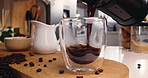 Glass, kitchen and pour coffee with french press for drink preparation, espresso or morning brew. Caffeine, cup and make beverage with plunger for liquid or healthy refreshment on table at home