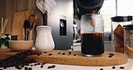 Glass, kitchen and pour ice coffee with plunger for drink preparation, espresso or morning brew. Caffeine, jar and cold beverage with cubes, liquid and hands of person with french press at home