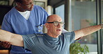 Nurse, help and old man in nursing home, stretching and physical therapy for pain relief or recovery. Assisted living, caregiver and elderly patient with injury, people or arm exercise for wellness