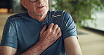 Fitness, hands or senior man with heart attack in home from workout strain, cramps or health emergency. Exercise, old person and chest pain in house with cardiac arrest, coronary disease and pressure