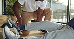 Physiotherapy, personal trainer and man in home with stretching, muscle recovery and fitness. Active, person or coach in house with support for physio exercise, healing ankle injury and joint pain.