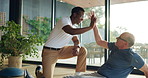 Physiotherapist, high five and man with motivation at clinic for wellness, recovery and healing process. People, senior patient and support with physical therapy, goals and rehabilitation for injury