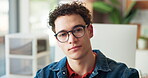 Face, serious and man in office with glasses, entry level and skill growth in corporate job. Portrait, about us and marketing intern in workplace with confidence, development or goals in career start