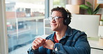 Dancing, happy man and listening to music in office with computer, headphones and streaming service. Smile, business and person in workplace with wireless technology for online radio, song and audio.