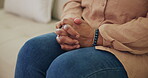 Woman, waiting and hands for therapy, concern or stress with anxiety support in home living room. Female person, counseling or scared for mental health, understanding or anticipation for consultation