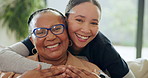 Hug, caregiver and face of senior woman on sofa for assisted living, support and medical service. Retirement home, happy and portrait of nurse embrace mature person for wellness, bonding and care