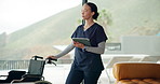 Nurse, wheelchair and woman with tablet, healthcare and internet with online information. Person, caregiver and professional with technology, medical service and digital app for schedule and network