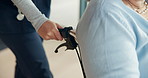 Hand, wheelchair and senior woman with nurse, healthcare and assisted living facility with help. Closeup, caregiver and person with disability, retirement and patient with support and elderly home
