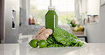 Vegetables, health and fruit with green juice in kitchen for nutrition, detox drink and wellness. Supplement, vitamins and weight loss with smoothie in home for food, liquid and organic beverage