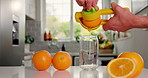 Nutrition, orange or person in kitchen with juicer, antioxidant or citrus benefit in morning drink. Organic, vitamin c or man in home with extractor, gut health or digestion in breakfast beverage.